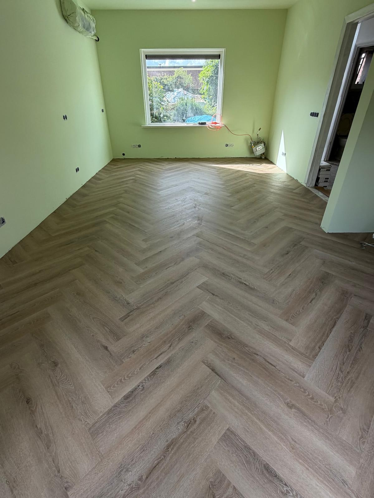 Close-up of a laid herringbone PVC floor