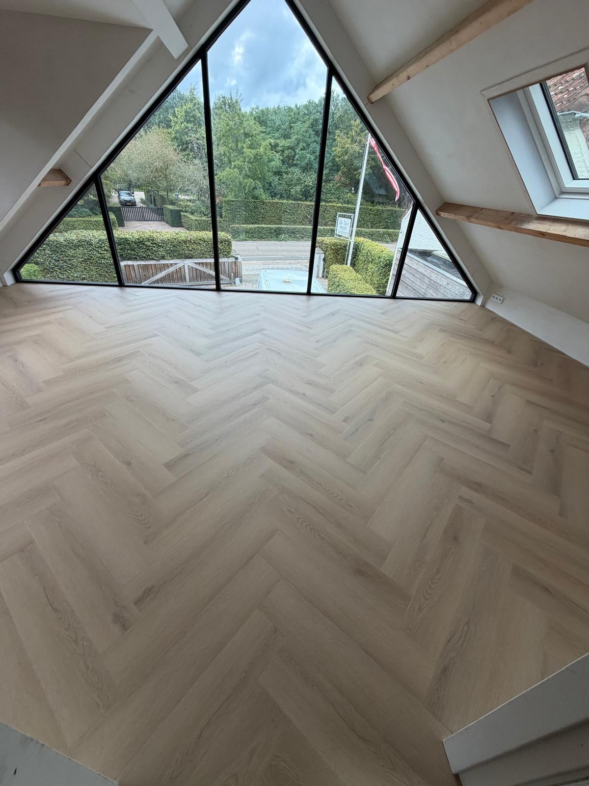 Finished herringbone PVC floor in a bright room